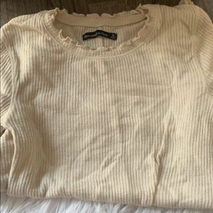 Long sleeve, indented cream color shirt